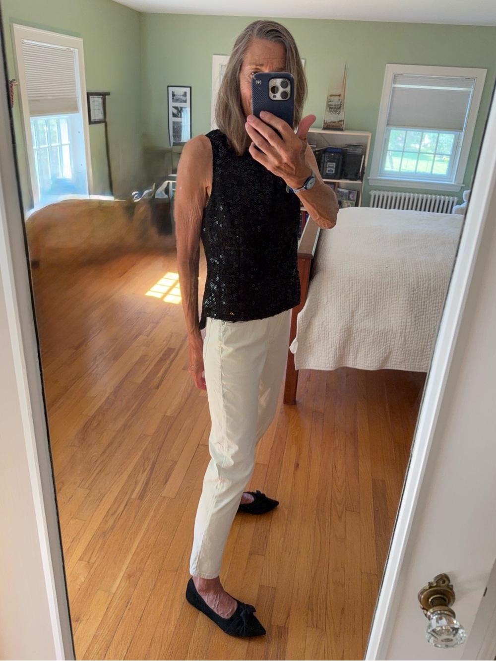 Kay Unger’s black sparkling, sleeveless top, size 8